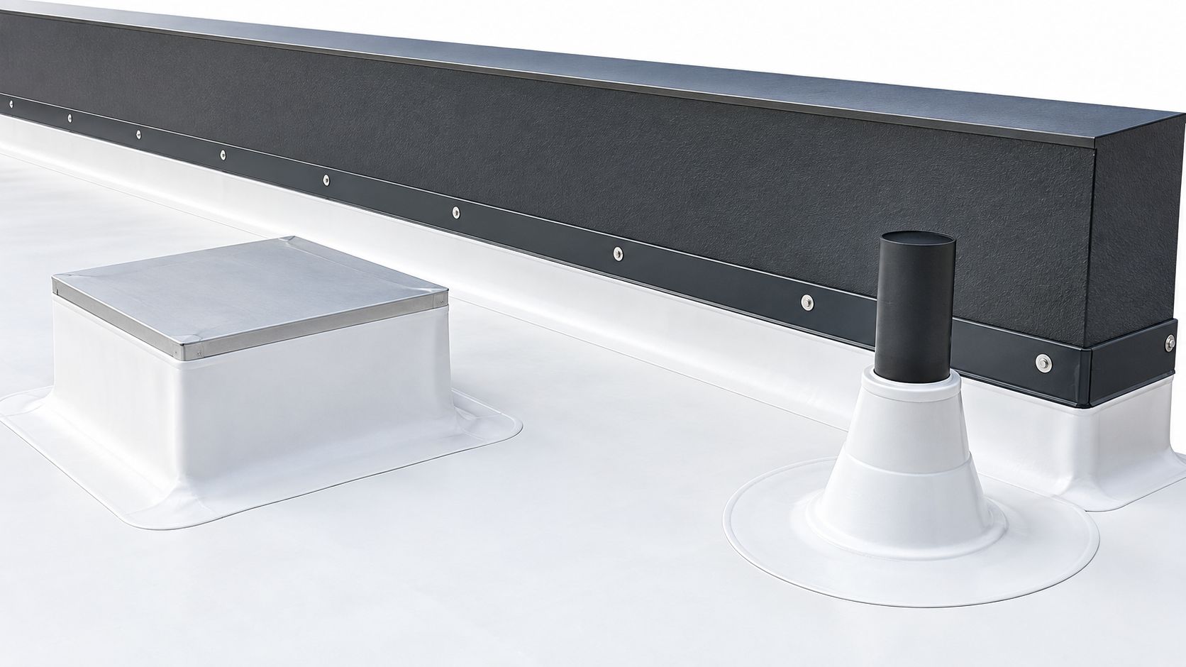 A close-up of a white TPO flat roof featuring a vent pipe and a metal curb flashing.